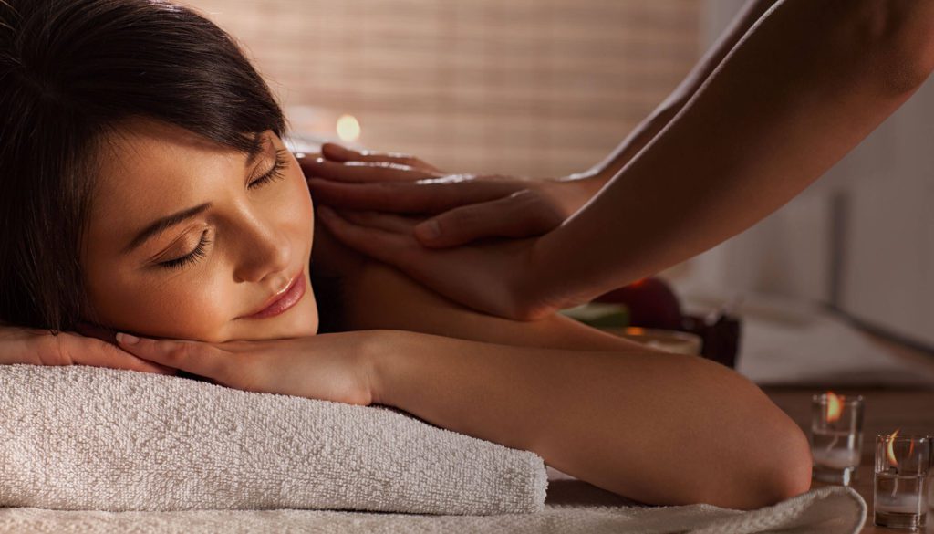 Massage therapist working on a client's back