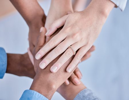 Business people, diversity and hands together above in trust, partnership or collaboration at the o.